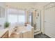 Bright bathroom featuring a soaking tub and separate glass shower at 10212 E Betony Dr, Scottsdale, AZ 85255