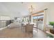 Well-lit dining area with a modern chandelier, table with seating, and a large window at 10212 E Betony Dr, Scottsdale, AZ 85255