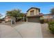 Charming two-story home boasts a desert landscape, a two-car garage, and a tile roof at 10212 E Betony Dr, Scottsdale, AZ 85255