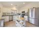 Bright kitchen features white cabinetry, stainless steel appliances, and a butcher block island at 10212 E Betony Dr, Scottsdale, AZ 85255