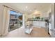 Well-lit kitchen with white cabinets, stainless steel appliances, and sliding door to patio at 10212 E Betony Dr, Scottsdale, AZ 85255