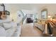 Bright, cozy living room featuring neutral furniture and a piano at 10212 E Betony Dr, Scottsdale, AZ 85255