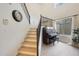 Stairway in a bright living room with a piano at 10212 E Betony Dr, Scottsdale, AZ 85255