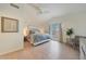 Spacious main bedroom with ample natural light, a ceiling fan, and calming decor at 10212 E Betony Dr, Scottsdale, AZ 85255