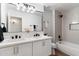 Modern bathroom with double vanity, quartz countertop, and a bathtub shower combo at 10215 E Hillery Dr, Scottsdale, AZ 85255