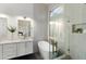 Bright bathroom featuring a soaking tub, standing shower, modern fixtures and neutral tiling at 10215 E Hillery Dr, Scottsdale, AZ 85255