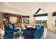 Bright living room with vaulted ceilings, large windows, and comfortable blue sofas at 10301 N 128Th St, Scottsdale, AZ 85259