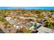 Overhead image of residential area with mature trees and a sparkling pool, community close to golf at 1031 W Indian Hills Pl, Phoenix, AZ 85023