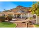 Picture-perfect backyard featuring a small bridge, mature landscaping, outdoor seating, and mountain views at 1031 W Indian Hills Pl, Phoenix, AZ 85023