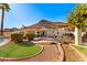 Beautiful backyard with a bridge, lush landscaping, covered patio, and mountain views at 1031 W Indian Hills Pl, Phoenix, AZ 85023