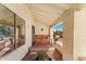 Inviting covered front porch with traditional brickwork and a sunny desert view at 1031 W Indian Hills Pl, Phoenix, AZ 85023