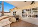 Covered outdoor kitchen featuring a built-in grill and counter space on a stone patio at 1031 W Indian Hills Pl, Phoenix, AZ 85023