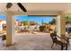 Covered patio offering scenic views of the beautifully landscaped backyard and desert plants at 1031 W Indian Hills Pl, Phoenix, AZ 85023