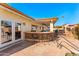 Outdoor covered patio, complete with a stylish bar and seating area, perfect for entertaining at 1031 W Indian Hills Pl, Phoenix, AZ 85023