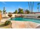 Backyard pool featuring a waterfall, diving board, and desert landscaping at 1031 W Indian Hills Pl, Phoenix, AZ 85023