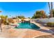 Backyard swimming pool with a small waterfall feature and desert landscaping at 1031 W Indian Hills Pl, Phoenix, AZ 85023