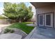 Lush backyard with green lawn and landscaped borders, perfect for outdoor enjoyment at 1054 W Park Ave, Gilbert, AZ 85233