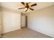 Bedroom with ceiling fan, carpeted floor and closet at 1054 W Park Ave, Gilbert, AZ 85233