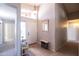 Bright and airy foyer featuring an arched window, modern lighting, and stylish decor at 1054 W Park Ave, Gilbert, AZ 85233