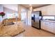 Well-lit kitchen with granite countertops, stainless steel appliances, and ample white cabinetry for storage at 1054 W Park Ave, Gilbert, AZ 85233