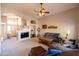 Open concept living room with a large TV and a glimpse of the entry, providing a welcoming atmosphere at 1054 W Park Ave, Gilbert, AZ 85233