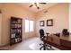 Office with a desk, bookcase, ceiling fan and carpeted floor at 1054 W Park Ave, Gilbert, AZ 85233