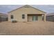 Back exterior featuring low-maintenance rock landscaping, and a covered patio at 10705 E Sunflower Ct, Florence, AZ 85132