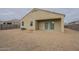 Back exterior view of the home featuring a covered patio and low maintenance landscaping at 10705 E Sunflower Ct, Florence, AZ 85132