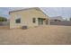 Rear exterior of the home with low maintenance gravel landscaping, and a covered patio at 10705 E Sunflower Ct, Florence, AZ 85132