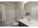 Bright bathroom featuring a shower-tub combo and single sink vanity with a large mirror at 10705 E Sunflower Ct, Florence, AZ 85132