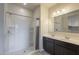 Bathroom featuring a dual sink vanity, mirror, and shower with curtain at 10705 E Sunflower Ct, Florence, AZ 85132