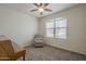 Bedroom with a chair, piano, ceiling fan, and natural light at 10705 E Sunflower Ct, Florence, AZ 85132