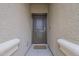 Entryway showcasing a solid front door with sidelights and a welcome mat at 10705 E Sunflower Ct, Florence, AZ 85132