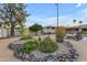 Landscaped backyard featuring desert landscaping, lounge chairs and a covered patio at 11041 N 44Th St, Phoenix, AZ 85028