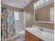 Clean bathroom with a vanity, sink, mirror, and shower with tub at 11041 N 44Th St, Phoenix, AZ 85028