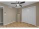 Bedroom featuring neutral walls, hardwood floors, and a closet, offering a serene retreat at 11041 N 44Th St, Phoenix, AZ 85028