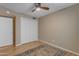 Comfortable bedroom with ceiling fan, wood floors, and a colorful rug at 11041 N 44Th St, Phoenix, AZ 85028