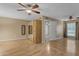 Spacious bedroom with wood flooring, ceiling fan, and closet at 11041 N 44Th St, Phoenix, AZ 85028