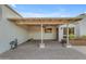 Covered carport with a brick floor, offering a convenient and protected parking area for vehicles at 11041 N 44Th St, Phoenix, AZ 85028