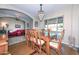 Bright dining room featuring a wooden table and decorative chandelier at 11041 N 44Th St, Phoenix, AZ 85028