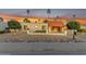 Charming home featuring a red tile roof and desert landscaping against a beautiful sunset at 11041 N 44Th St, Phoenix, AZ 85028