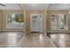 Bright foyer with tile flooring, decorative windows, and a glass front door at 11041 N 44Th St, Phoenix, AZ 85028