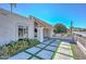 Beautiful home with a red-tiled roof, stucco walls, modern concrete pathway and desert landscape with native cacti at 11041 N 44Th St, Phoenix, AZ 85028