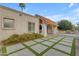 Exterior home view with concrete and turf driveway, lush desert landscaping at 11041 N 44Th St, Phoenix, AZ 85028