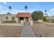 Home exterior with a gated front patio and desert landscaping features at 11041 N 44Th St, Phoenix, AZ 85028