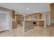 Spacious kitchen featuring wood cabinetry, stainless steel appliances, and a central island at 11041 N 44Th St, Phoenix, AZ 85028