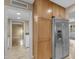 Pantry space with wood cabinets and stainless steel refrigerator at 11041 N 44Th St, Phoenix, AZ 85028