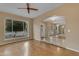 Inviting living room with a ceiling fan, large window, and arched doorway at 11041 N 44Th St, Phoenix, AZ 85028