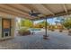 Covered patio area overlooking a sparkling pool and serene landscaping; perfect for relaxing or entertaining outdoors at 11041 N 44Th St, Phoenix, AZ 85028