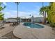 Sparkling pool and hot tub surrounded by a patio, lounge chairs and desert landscaping at 11041 N 44Th St, Phoenix, AZ 85028